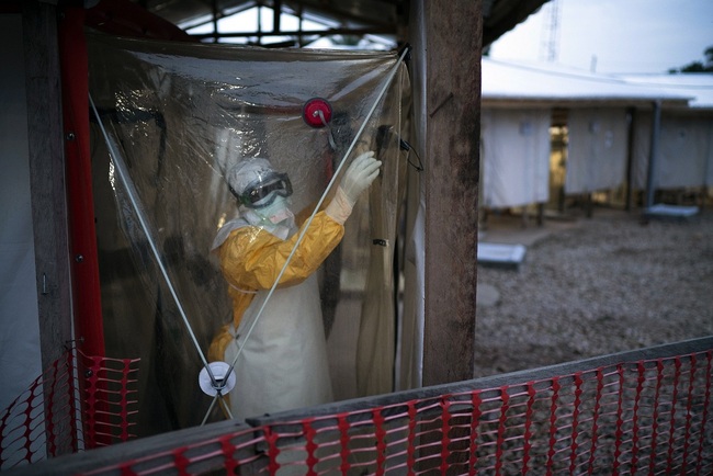 A health worker wearing protective suits enters an isolation pod to treat a patient at a treatment center in Beni, Congo DRC, July 13, 2019. [File Photo: AP via IC/Jerome Delay]