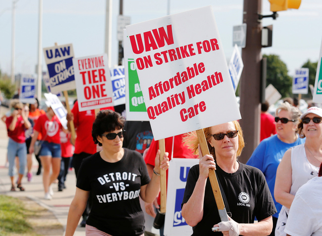 Striking General Motors Detroit-Hamtramck Assembly plant workers and their supporters walk the picket line during the United Auto Workers national strike in Hamtramck, Michigan, U.S., September 22, 2019.  [Photo: vcg.com]