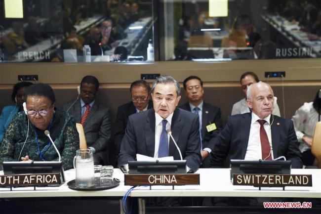 Chinese State Councilor and Foreign Minister Wang Yi addresses the commemoration of the 70th anniversary of the signing of the Geneva Conventions at the UN headquarters in New York, Sept. 23, 2019. [Photo: Xinhua/Han Fang]