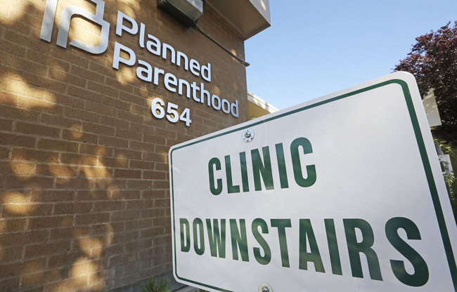 In this Aug. 21, 2019, file photo, a sign is displayed at Planned Parenthood of Utah in Salt Lake City. [Photo: AP]