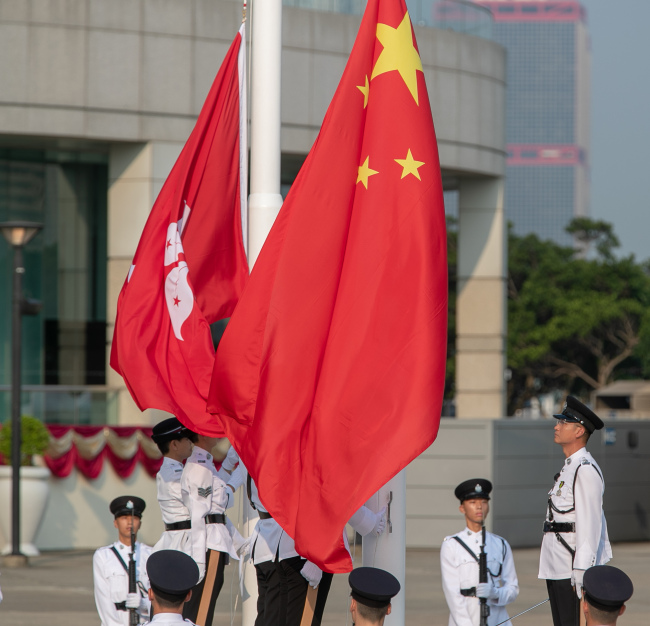 A national flag raising ceremony is held at the Golden Bauhinia Square to celebrate the 70th anniversary of the founding of PRC at 8 a.m. in Hong Kong Special Administrative Region, on October 1, 2019. [Photo: IC]