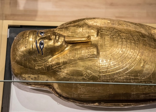 A picture taken on October 1, 2019, shows the Golden Coffin of Nedjemankh, on display at the National Museum of Egyptian Civilization in Cairo, following its repatriation from the US. [Photo: AFP/Khaled Desoukl]