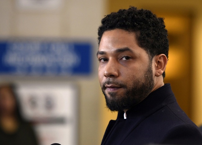 File Photo: Actor Jussie Smollett talks to the media before leaving Cook County Court after his charges were dropped, in Chicago on March 26, 2019. [Photo: AP/Paul Beaty]