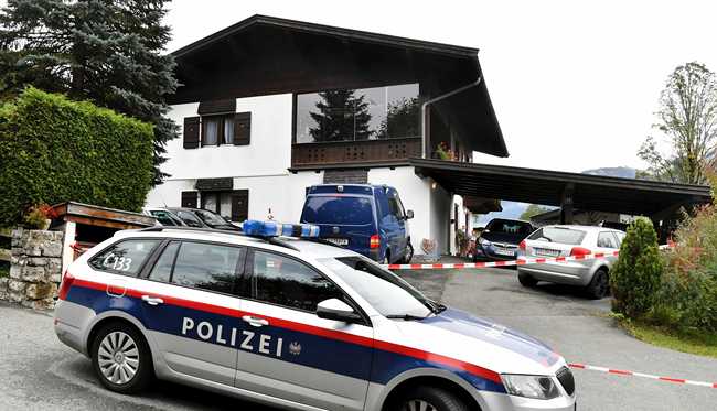 A police car is parked in front of a house in Kitzbuehl, Austria, Sunday, Oct. 6, 2019. Austrian police say a 25-year-old man's in custody after allegedly killing his ex-girlfriend, her family, and her new boyfriend in the Alpine resort town of Kitzbuehel. The 25-year-old turned himself to police in the town east of Innsbruck and admitted to the five slayings early Sunday morning, Austrian news agency APA reported. [Photo: AP/Kerstin Joensson]