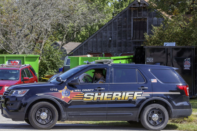 In this Sept. 19, 2019 file photo, Will County Sheriff's patrol is stationed outside the home of deceased Dr. Ulrich Klopfer in Unincorporated Crete, Ill. [Photo: AP]