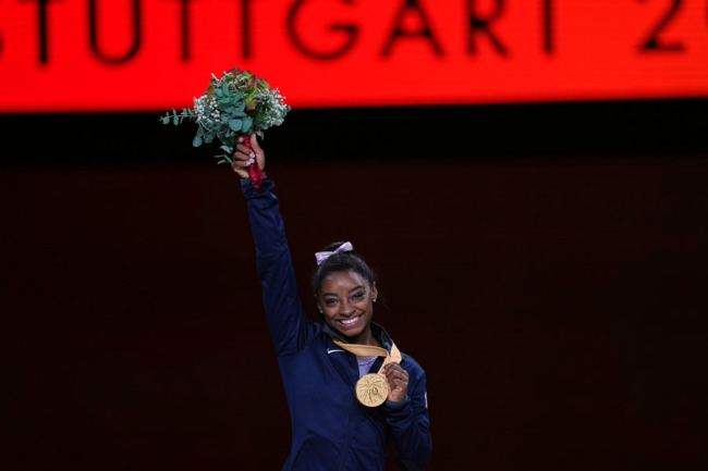 Simone Biles of United States of America while getting her gold in floor exercise for women during the 49th FIG Artistic Gymnastics World Championships at the Hanns Martin Schleyer Halle in Stuttgart, Germany. [Photo: IC]