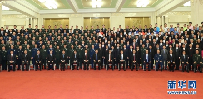 Chinese President Xi Jinping poses for a group photo with representatives of the personnel who had worked for the celebrations of the 70th anniversary of the founding of the People's Republic of China, on Wednesday, October 16, 2019, at the Great Hall of the People in Beijing. [Photo: Xinhua/Huang Jingwen]
