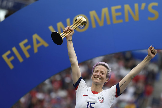 In this file photo taken on July 7, 2019 United States' forward Megan Rapinoe poses with the Golden Ball after the France 2019 Women’s World Cup football final match between USA and the Netherlands, at the Lyon Stadium in Lyon, central-eastern France. [Photo: AFP/CHRISTOPHE SIMON]