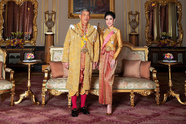 In this file undated handout from Thailand's Royal Office received on August 26, 2019, Thailand's King Maha Vajiralongkorn poses with royal noble consort Sineenat Bilaskalayani, also known as Sineenat Wongvajirapakdi. Thailand's King Maha Vajiralongkorn has stripped his 34-year-old consort of all titles, the palace announced October 21, a shock move less than three months after she was bestowed with a position that had not been used for nearly a century.[Photo: AFP/THAILAND'S ROYAL OFFICE] 