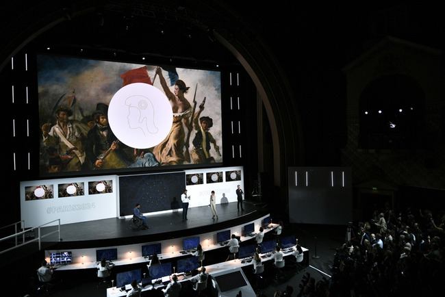 People attend a logo presentation ceremony for Paris 2024 Olympic Games at the Grand Rex cinema in Paris on October 21, 2019. [Photo: AFP/Stephane De Sakutin]