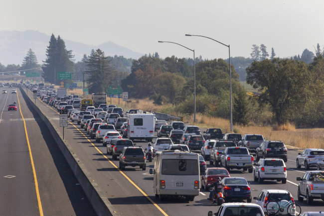 Traffic is backed up heading South on Highway 101 during mandatory evacuations due to predicted danger from the Kincade Fire, in Windsor, California, on Saturday, Oct. 26, 2019. [Photo: The Press Democrat via AP/Darryl Bush]