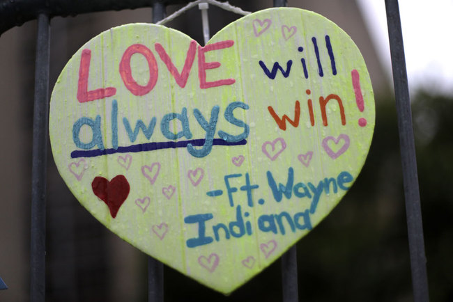 A sign hangs on a fence surrounding the Tree of Life synagogue in Pittsburgh on Saturday, Oct. 26, 2019. The first anniversary of the shooting at the synagogue, that killed 11 worshippers, is Oct., 27, 2019. [Photo: AP via IC/Gene J. Puskar]