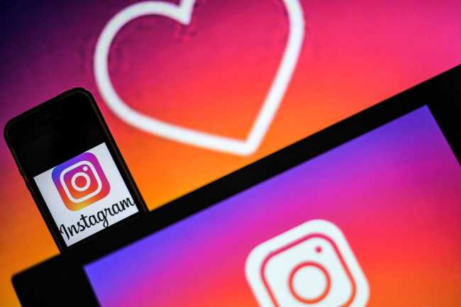 Logos of US social network Instagram are displayed on the screen of a computer and a smartphone, on May 2, 2019 in Nantes, western France. [Photo: LOIC VENANCE/AFP]
