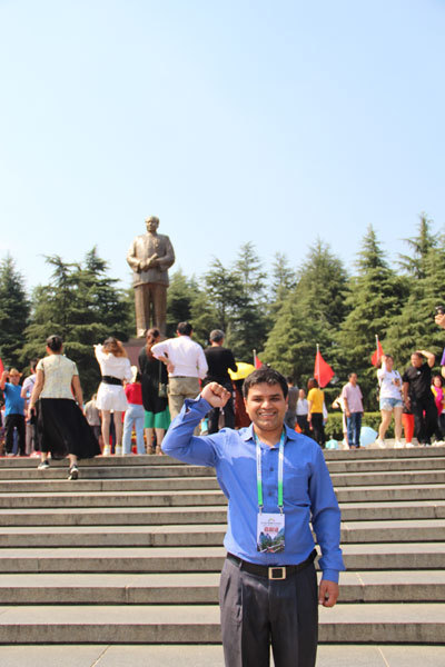 The writer in front of the statue of Chairman Mao at Shaoshan, Hunan Province. [Photo courtesy of Melsam Ojha]