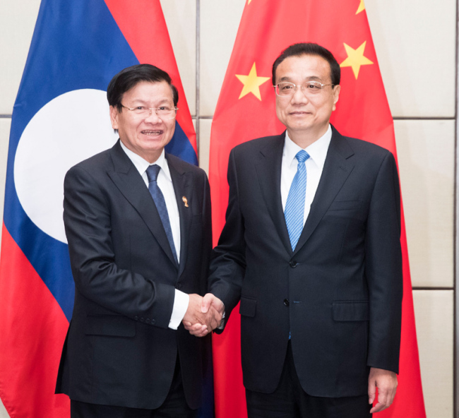Chinese Premier Li Keqiang on Sunday meets with Lao Prime Minister Thongloun Sisoulith on Sunday, November 3, 2019 on the sidelines of the 35th summit of the Association of Southeast Asian Nations (ASEAN) in Thailand. [Photo: gov.cn]