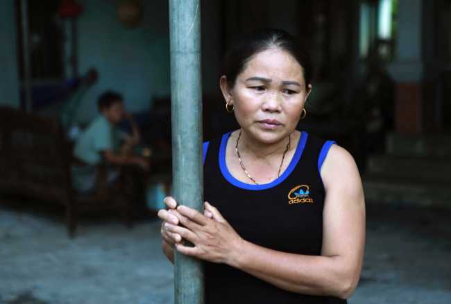 In this Oct. 28, 2019, photo, Hoang Thi Ai, mother of Hoang Van Tiep, who is feared to be among the England truck dead, stares off at home in Dien Thinh village, Nghe An province, Vietnam. [Photo: AP]