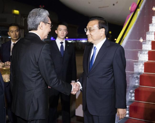 Chinese Premier Li Keqiang is welcomed by Thai Deputy Prime Minister Somkid Jatusripitak upon his arrival at the airport in Bangkok, Thailand, Nov. 2, 2019. [Photo: Xinhua/Huang Jingwen]
