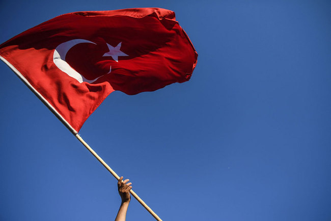 A man waves a Turkish flag in Istanbul on July 15, 2018. [File photo: AFP via VCG/Ozan Kose]