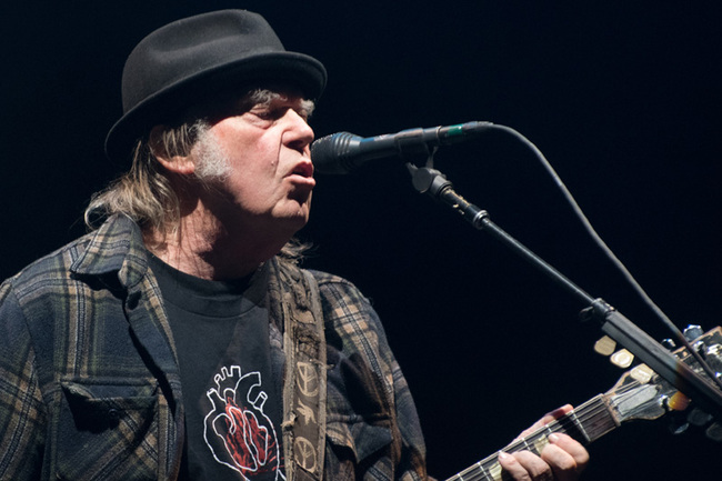 Neil Young performs on stage for his first time in Quebec City during 2018 Festival d'Ete on July 6, 2018.[File Photo: AFP]