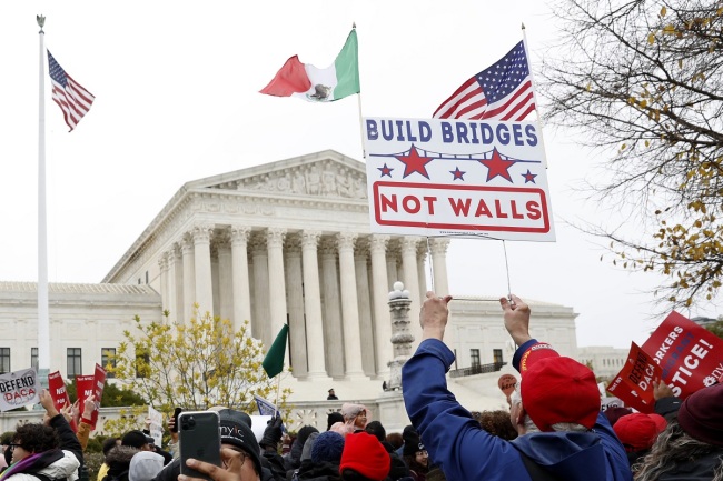 People rally outside the Supreme Court as oral arguments are heard in the case of President Trump's decision to end the Obama-era, Deferred Action for Childhood Arrivals program (DACA), Tuesday, Nov. 12, 2019, at the Supreme Court in Washington. [Photo: AP/Jacquelyn Martin]