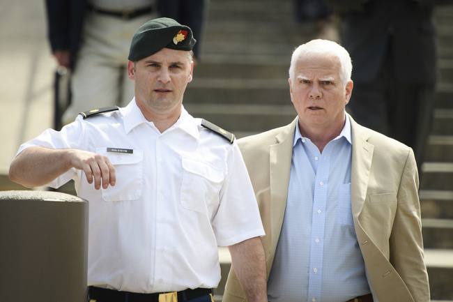 In this June 27, 2019, filke photo. Maj. Mathew Golsteyn, a former Army Special Forces soldier, leaves the Fort Bragg courtroom facility with his civilian lawyer, Phillip Stackhouse, right, after an arraignment hearing. President Donald Trump has pardoned a former U.S. Army commando set to stand trial next year in the killing of a suspected Afghan bomb-maker and for a former Army lieutenant who had been convicted of murder after he ordered his men to fire upon three Afghans, killing two, the White House announced late Friday. [Photo: Andrew Craft/The Fayetteville Observer via AP]