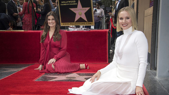 Actresses Idina Menzel (L) and Kristen Bell (R) are honored with stars on the Hollywood Walk of Fame, in Hollywood, California on November 19, 2019. [Photo: AFP/Mark Ralston]