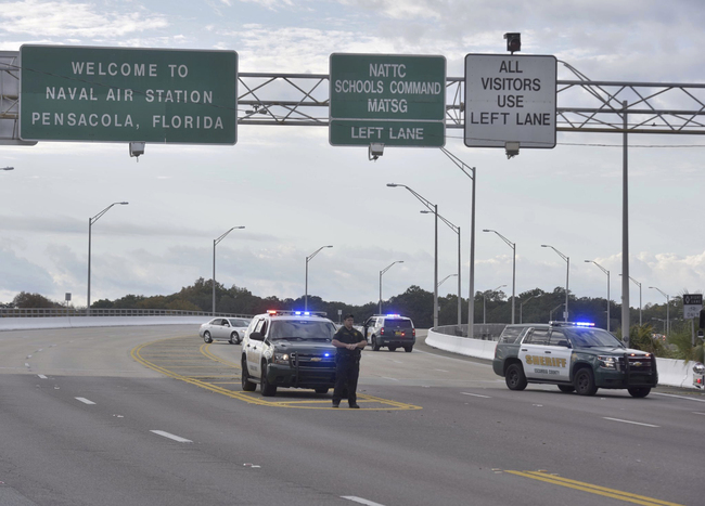 Police vehicles block the entrance to the Pensacola Air Base, Friday, Dec. 6, 2019 in Pensacola, Fla, United States. [Photo: Pensacola News Journal via AP/Tony Giberson]