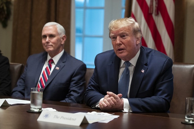 File Photo: Vice President Mike Pence listens as President Donald Trump speaks during a roundtable on school choice in the Cabinet Room of the White House, Monday, Dec. 9, 2019, in Washington.[Photo: AP/Evan Vucci]