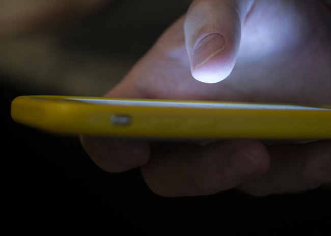 In this Aug. 11, 2019, file photo, a man uses a cell phone in New Orleans. [Photo: AP]