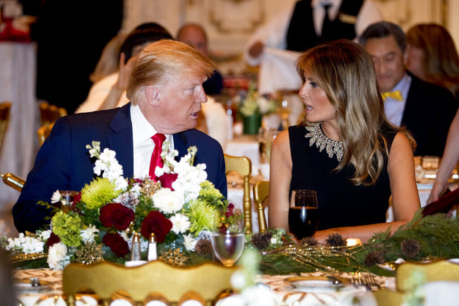 President Donald Trump and first lady Melania Trump talk at Mar-a-lago while there for Christmas Eve dinner in Palm Beach, Fla., Tuesday, Dec. 24, 2019. [Photo: AP]