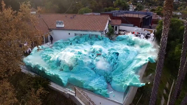 The blue foam grows to an incredible size. [Screenshot: YouTube/Nick Uhas]