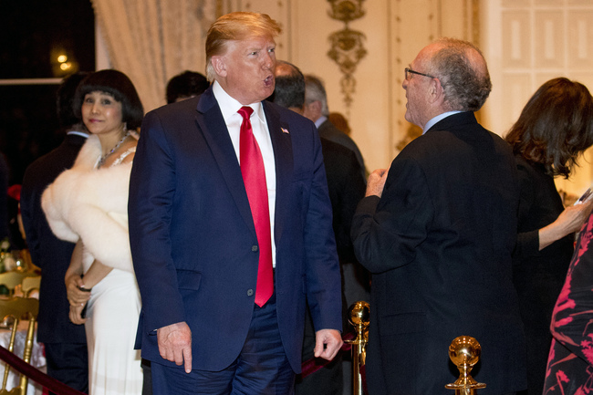 President Donald Trump speaks to attorney Alan Dershowitz, right, as he arrives for Christmas Eve dinner at Mar-a-lago in Palm Beach, Fla., Tuesday, Dec. 24, 2019. [Photo: AP]