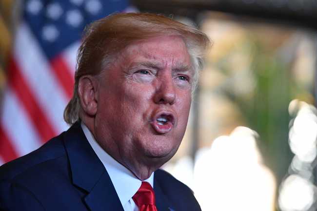 US President Donald Trump answers questions from reporters after making a video call to the troops stationed worldwide at the Mar-a-Lago estate in Palm Beach Florida, on December 24, 2019. [Photo: Nicholas Kamm/AFP]