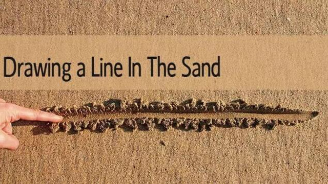 用中文说: "Draw a line in the sand"