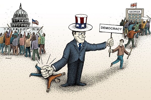 کاریکاتور|آشوبگری آمریکایی به بهانه دموکراسی
